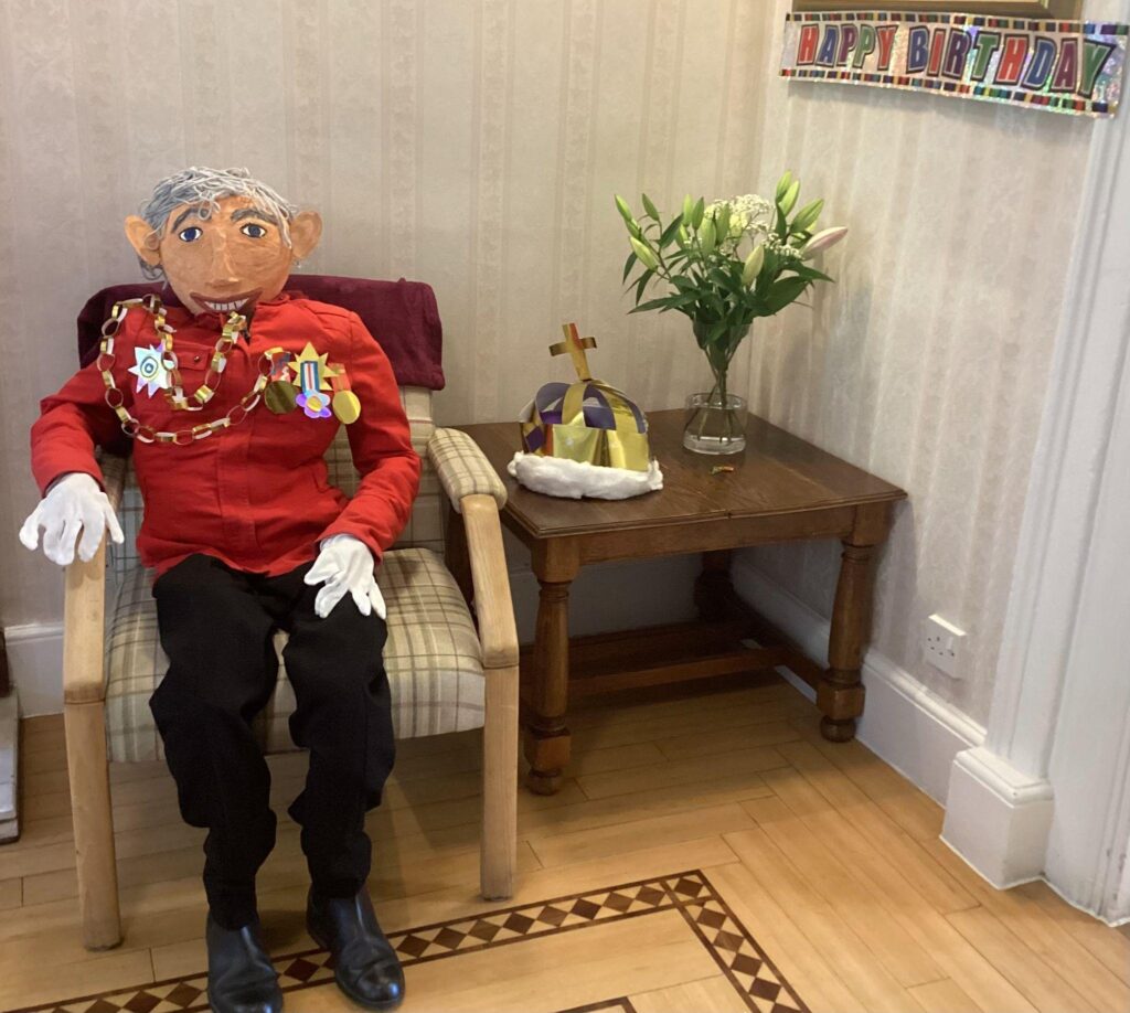 ‘King Charles’ greeting people in the hallway.