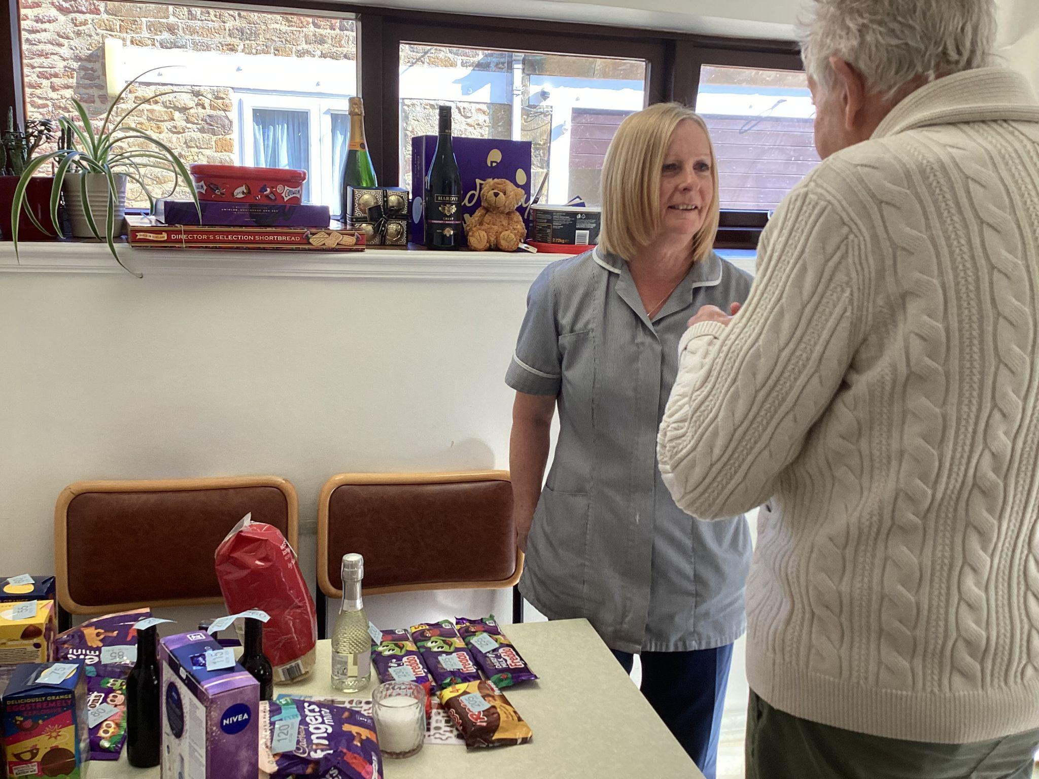 A staff member and a resident at the Big Breakfast Event.