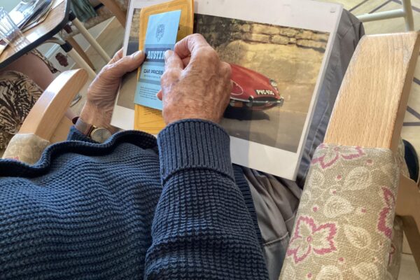 A resident looking at motor memorabilia. A resident looking at motor memorabilia.