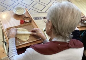 Residents making tasty cinnamon biscuits.