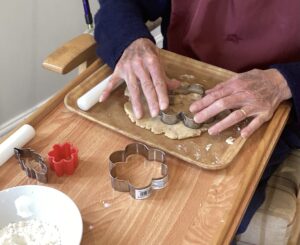 Residents making tasty cinnamon biscuits.